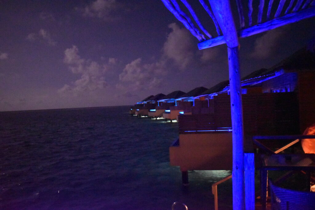 The blue light from the other villas with plunge pools.