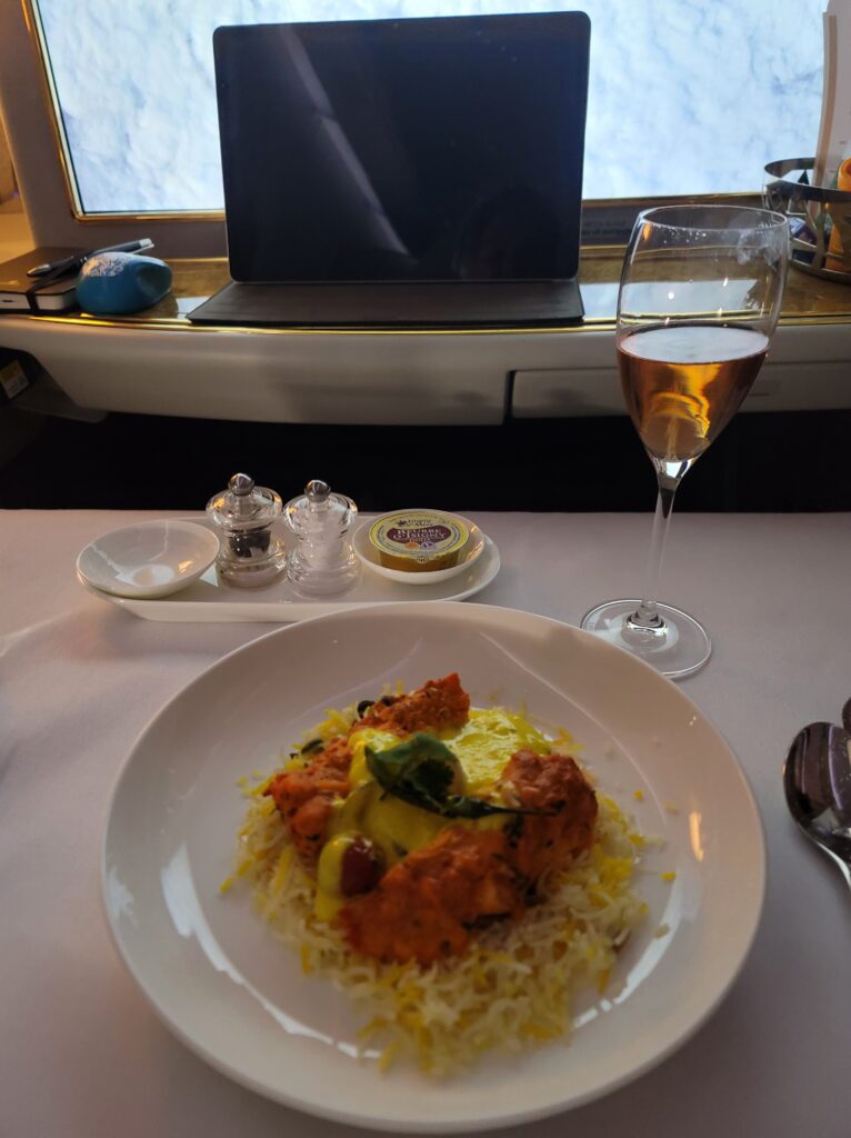 Lobster on basamati rice with pink champagne to drink.